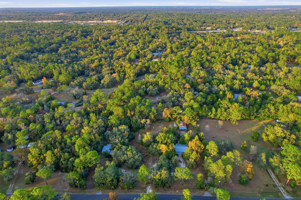 3050 East Possum Court Inverness, FL 34452 - Photo 42 of 65 an aerial view of a houses with a yard