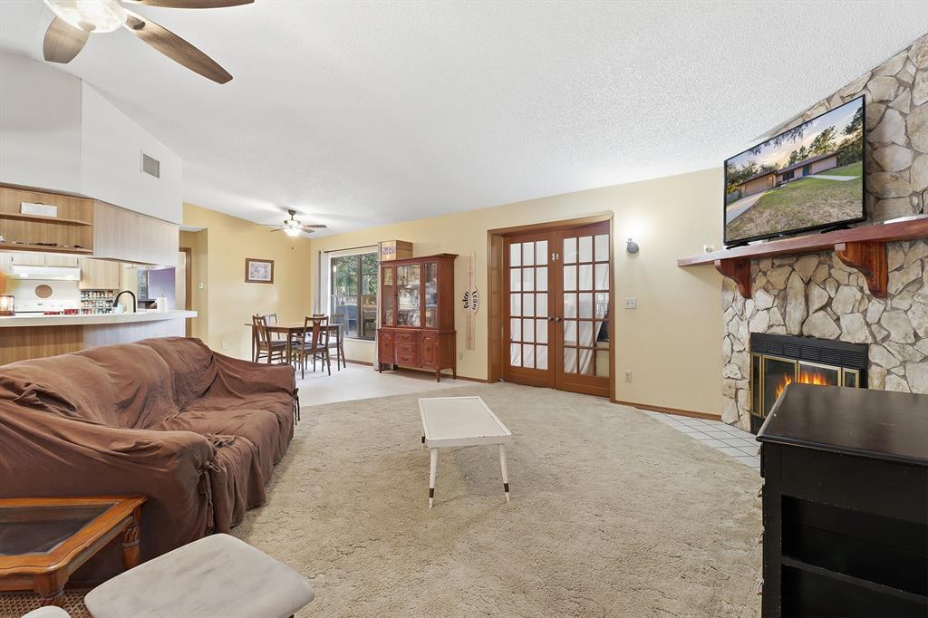 3050 East Possum Court Inverness, FL 34452 - Photo 9 of 65 a living room with furniture and a fireplace