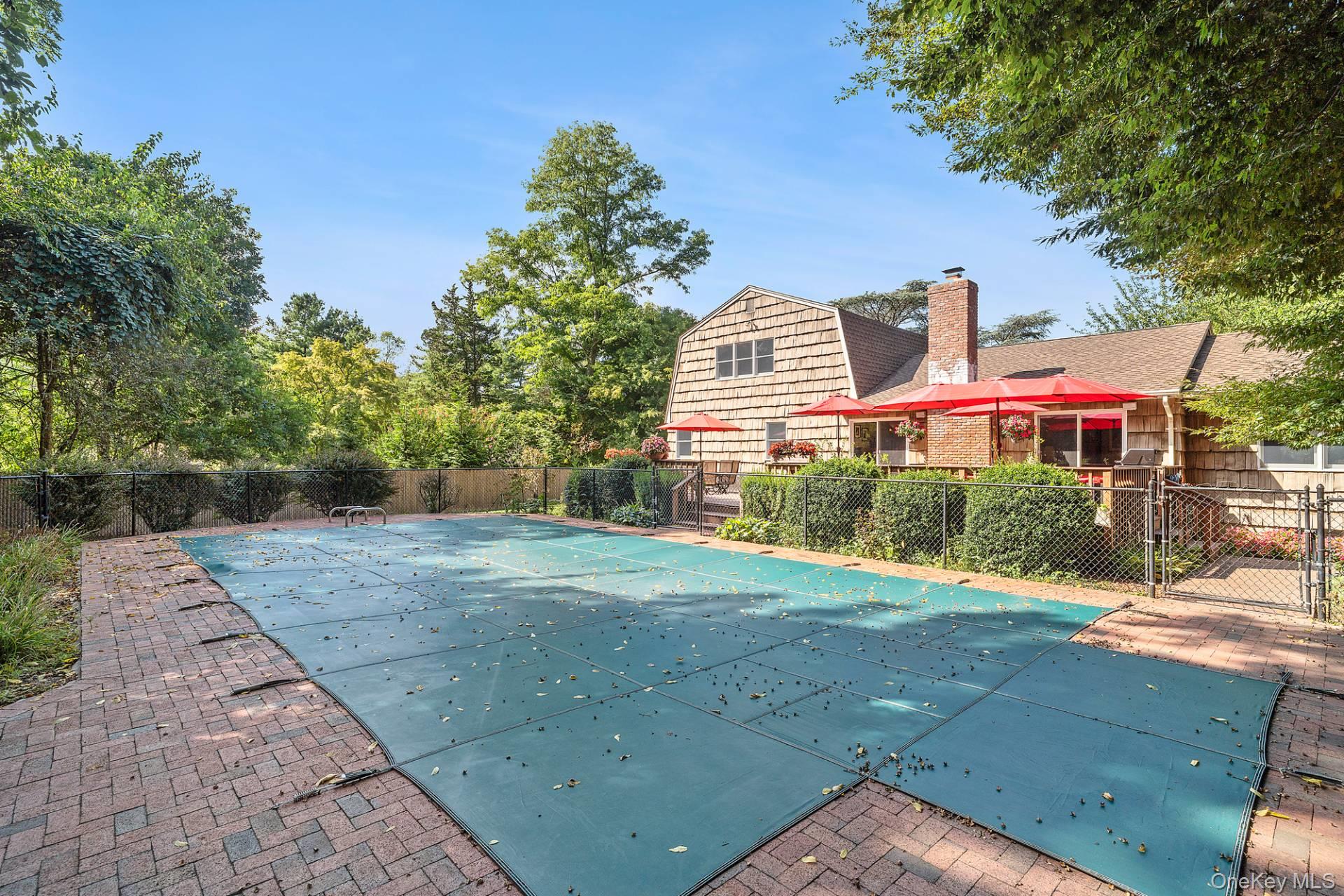 28 Plain View Drive Wading River, NY 11792 - Photo 18 of 20 a front view of a house with a yard and garage