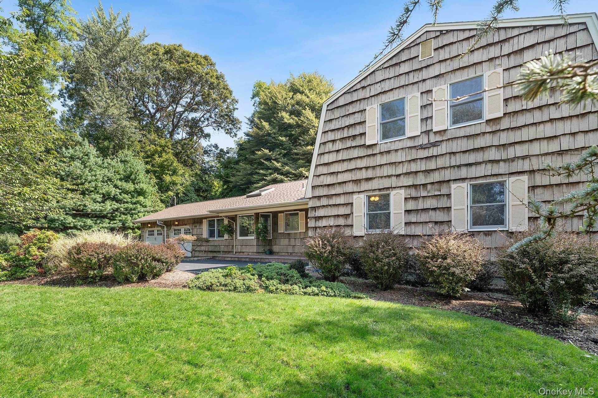 28 Plain View Drive Wading River, NY 11792 - Photo 20 of 20 a view of an house with backyard space and garden
