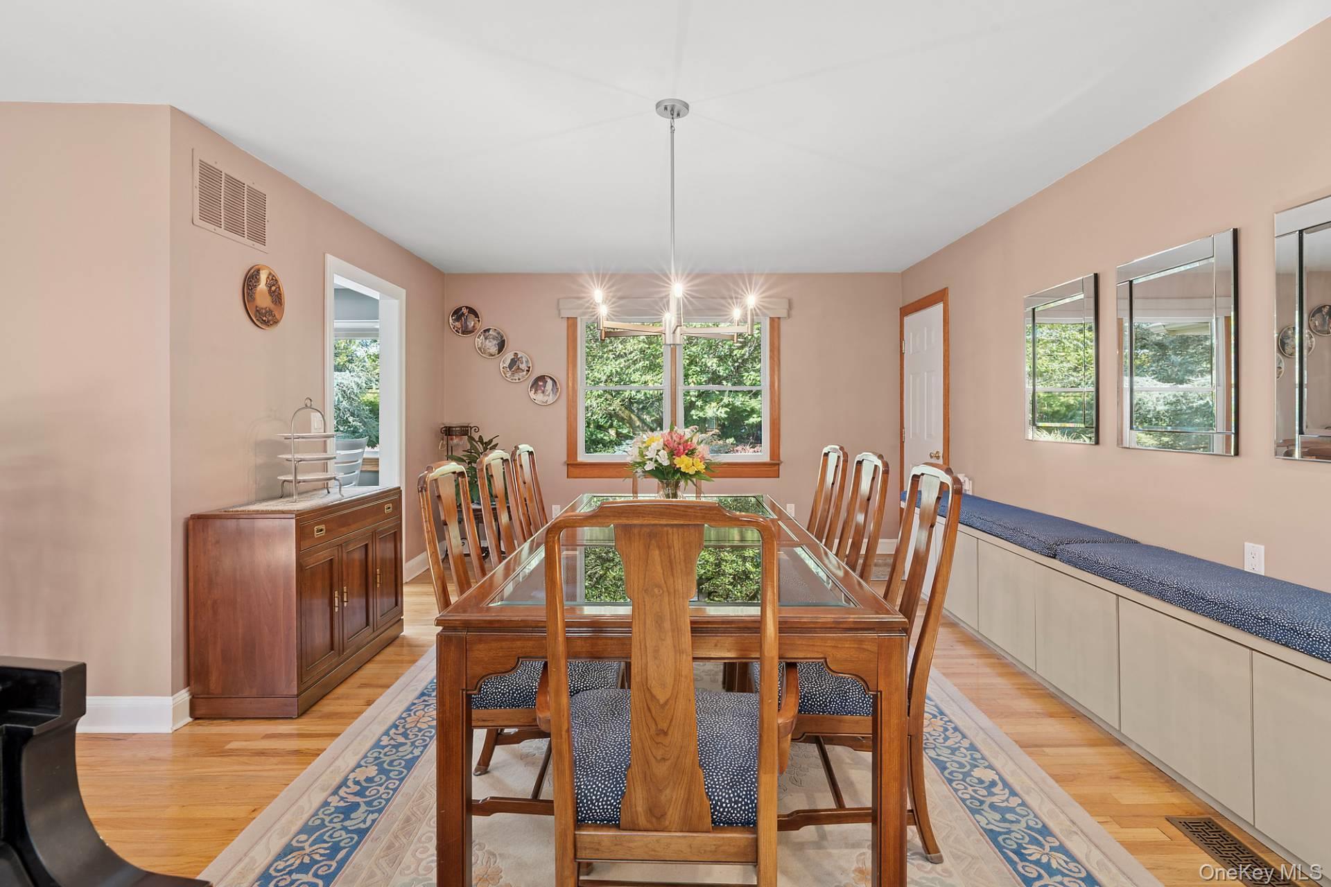 28 Plain View Drive Wading River, NY 11792 - Photo 4 of 20 a view of a dining room with furniture window and outside view