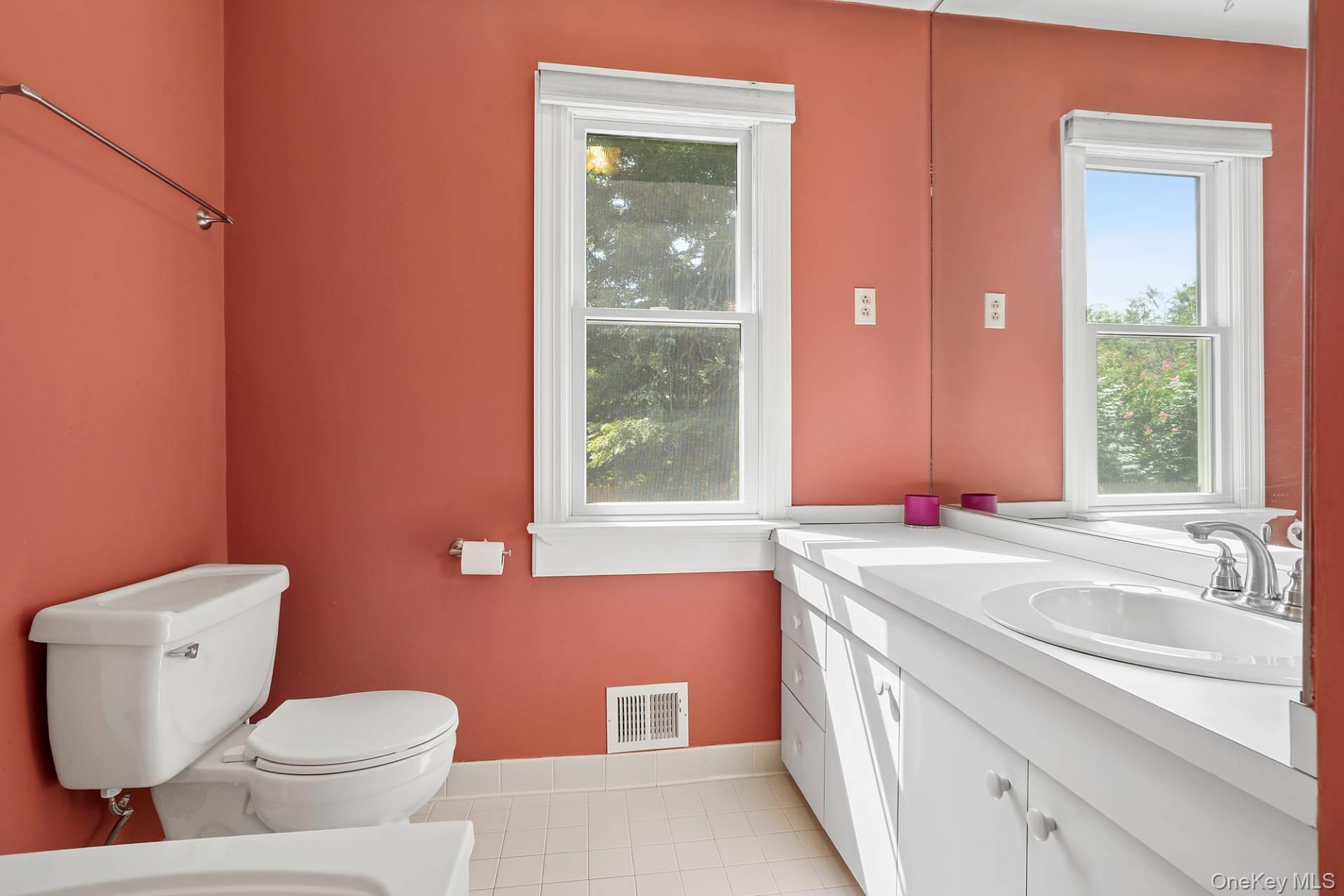 28 Plain View Drive Wading River, NY 11792 - Photo 9 of 20 a bathroom with a sink and a toilet