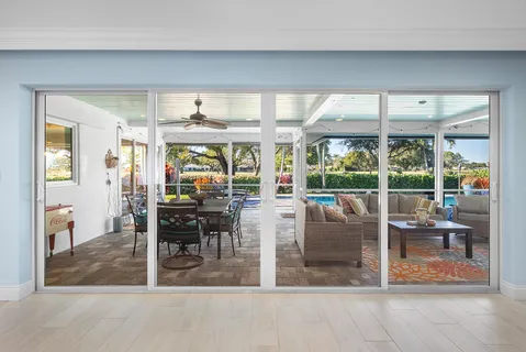 a front view of a house with a yard table and chairs