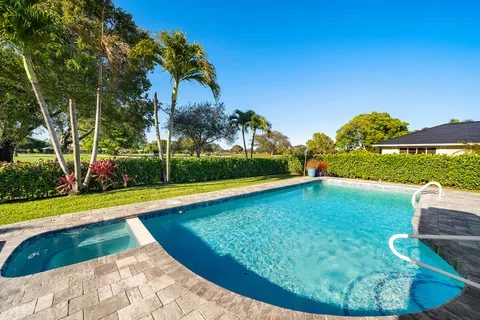 $1,125,000 | 413 South Country Club Drive, Atlantis, FL 33462