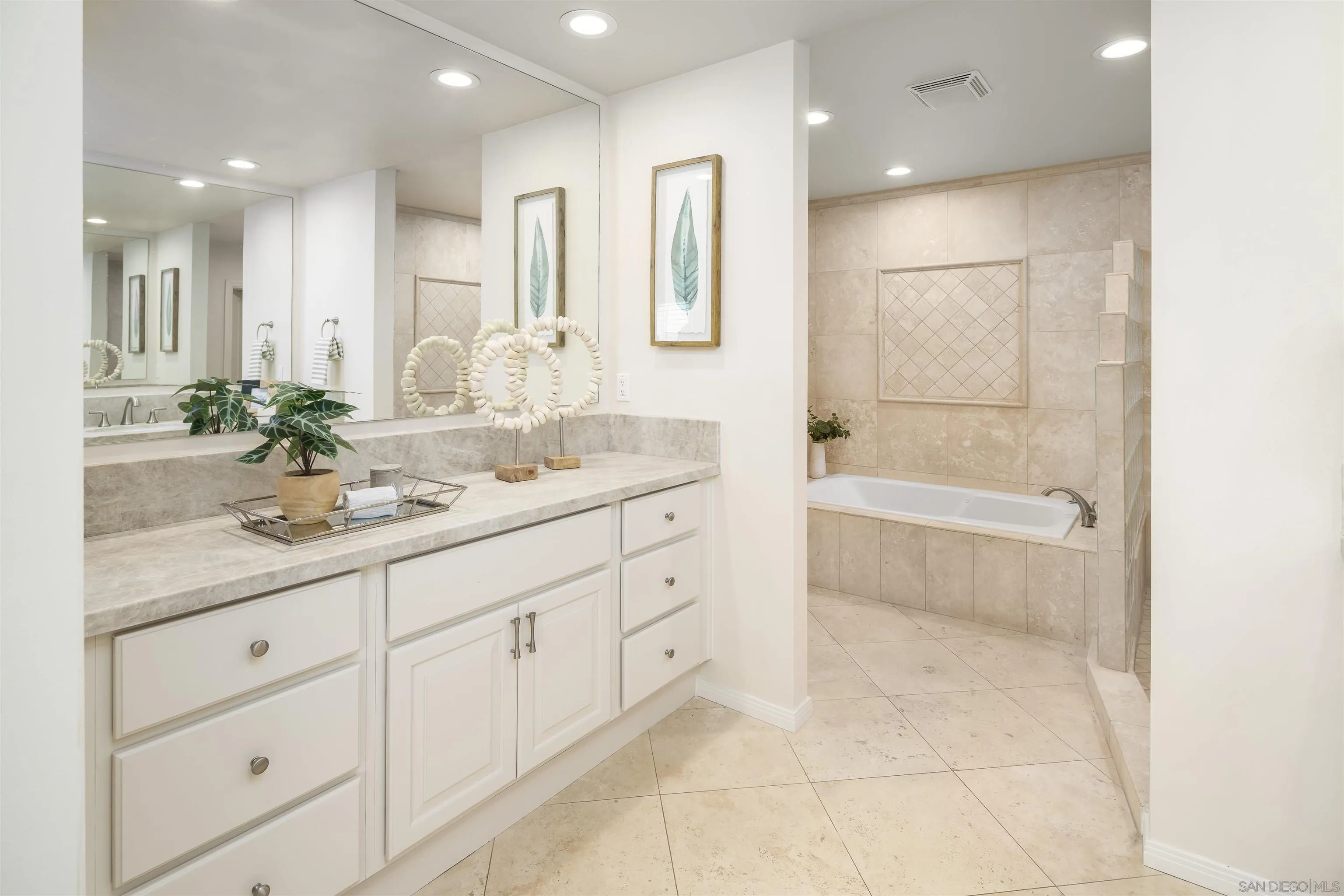 6129 La Flecha Rancho Santa Fe, CA 92067 - Photo 19 of 33 a bathroom with a sink a vanity a mirror and a bathtub