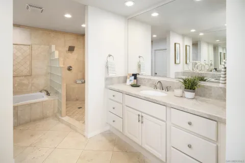a bathroom with a bathtub and shower
