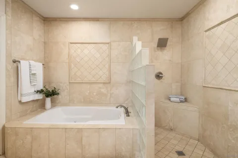 a spacious bathroom with a double vanity sink mirror and