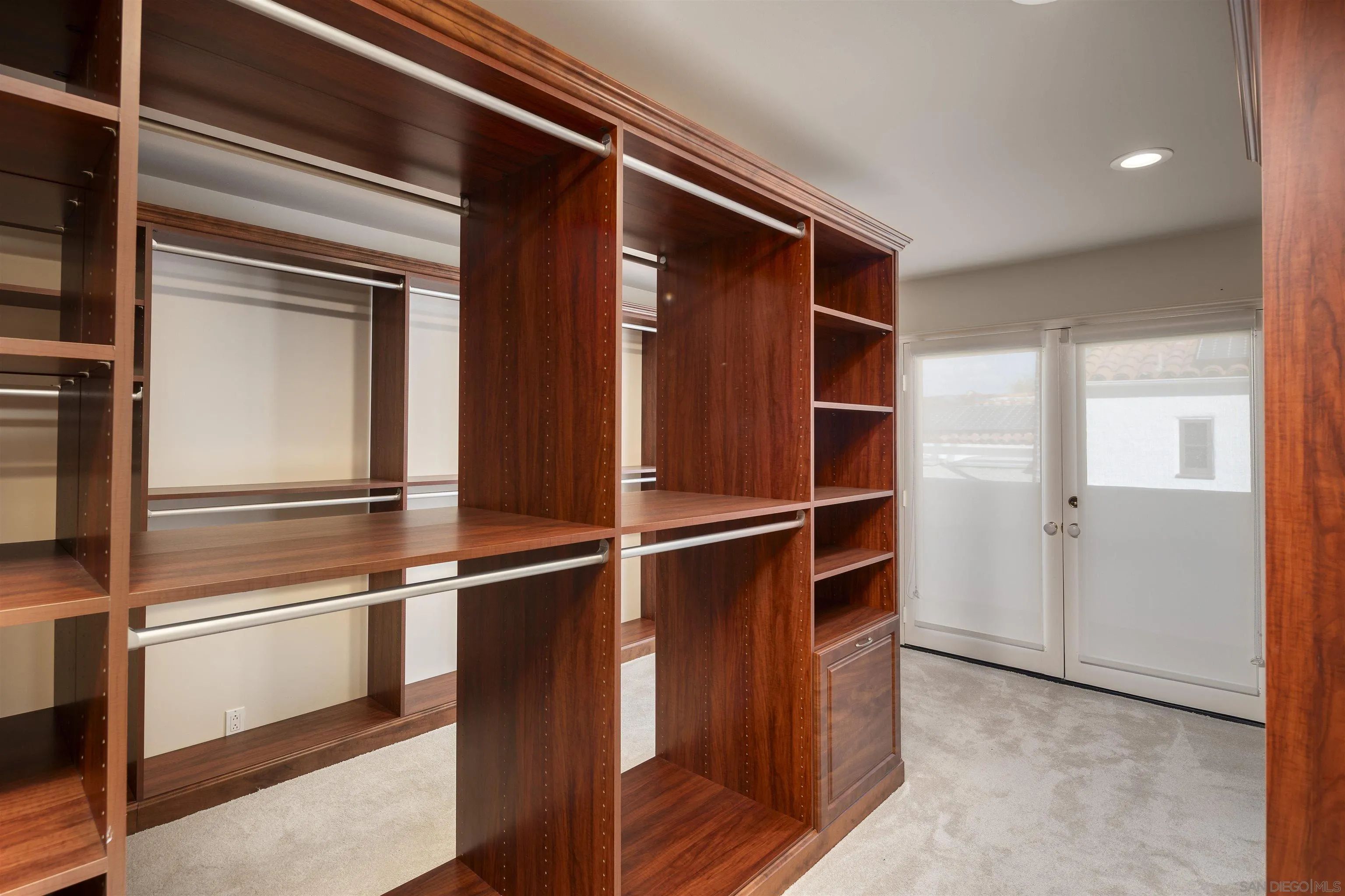 6129 La Flecha Rancho Santa Fe, CA 92067 - Photo 23 of 33 a room with wooden floor and closet