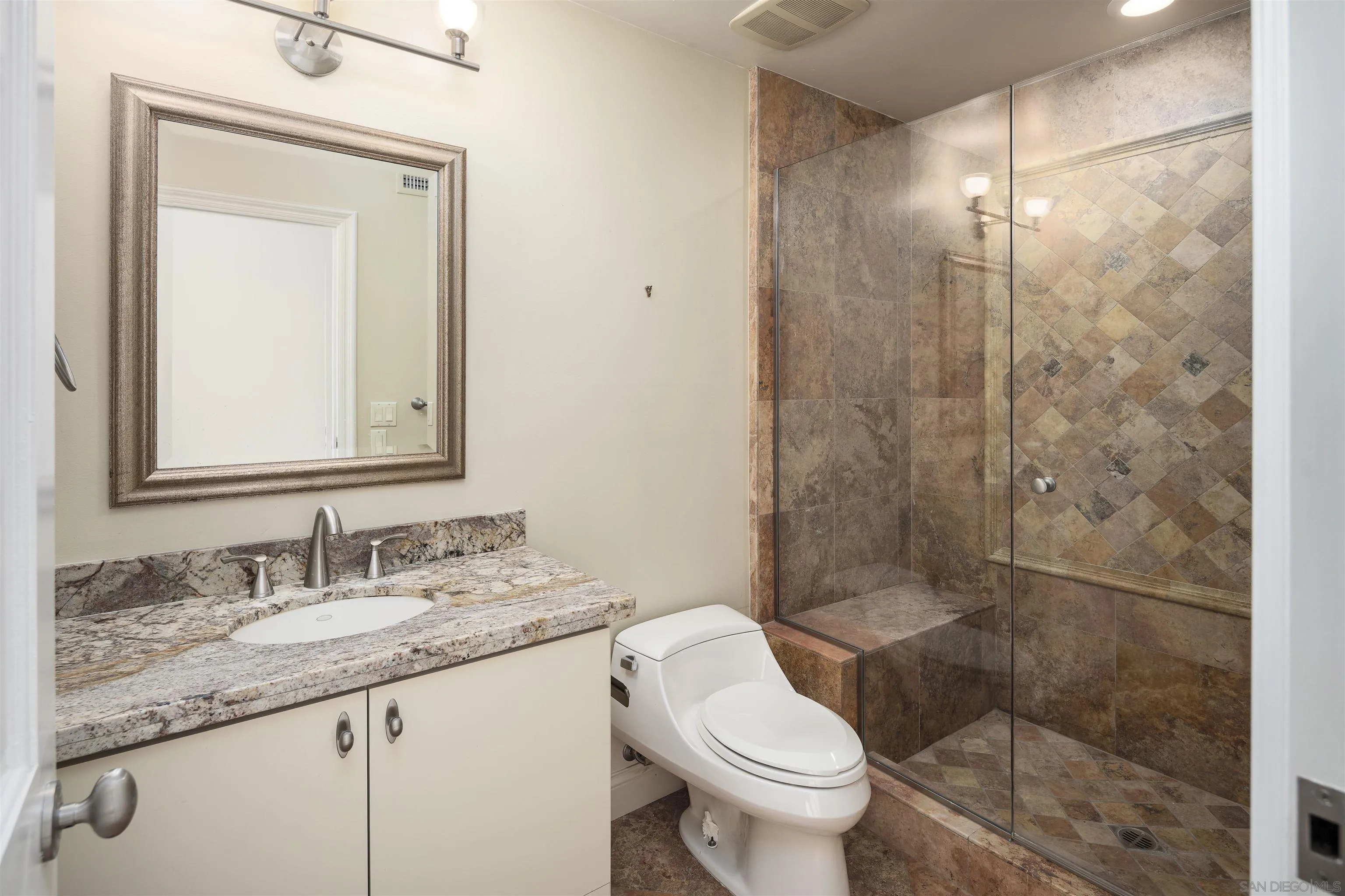 6129 La Flecha Rancho Santa Fe, CA 92067 - Photo 27 of 33 a bathroom with a granite countertop sink toilet and shower