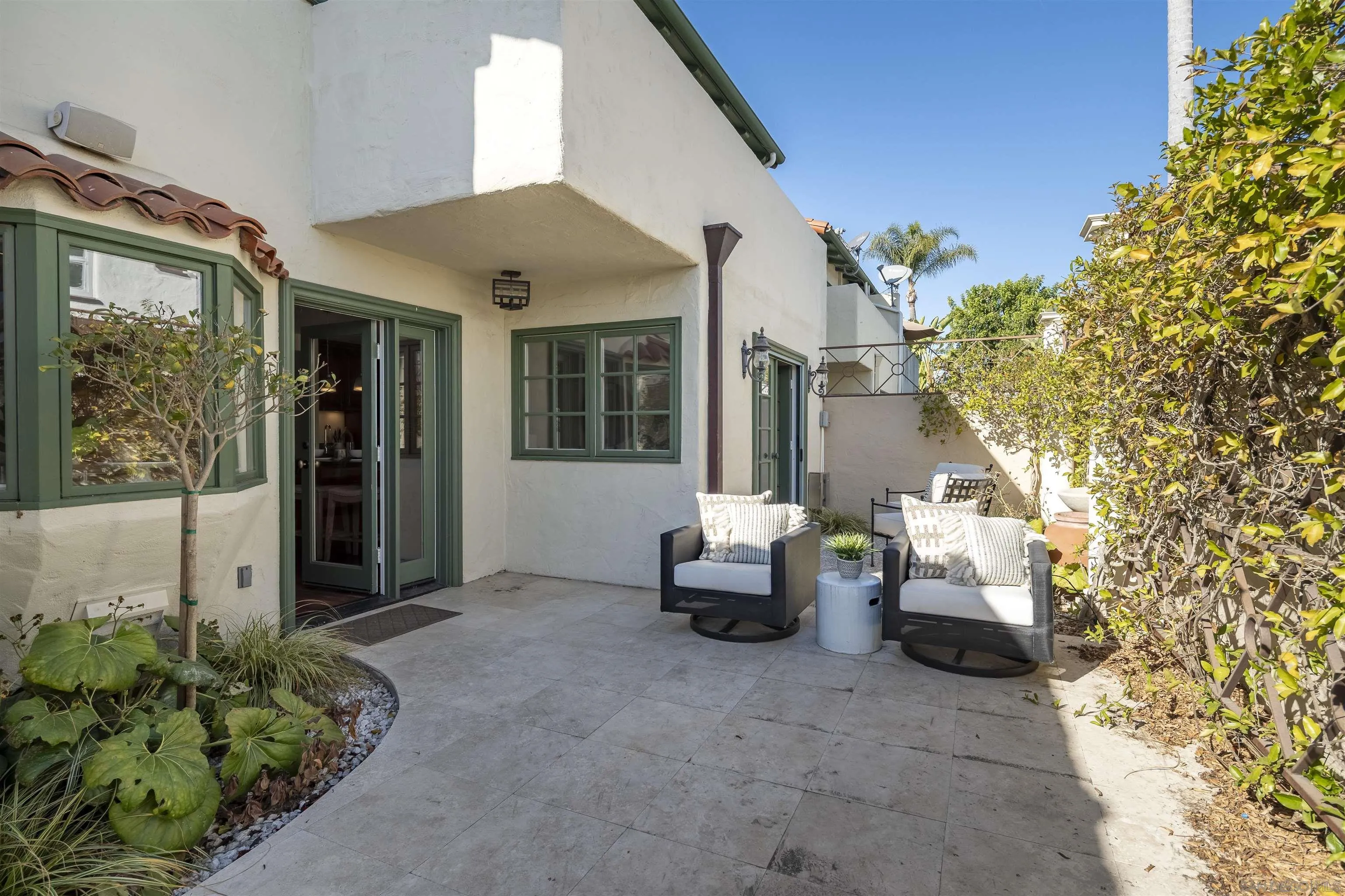 6129 La Flecha Rancho Santa Fe, CA 92067 - Photo 31 of 33 a view of patio with a table and chairs and potted plants
