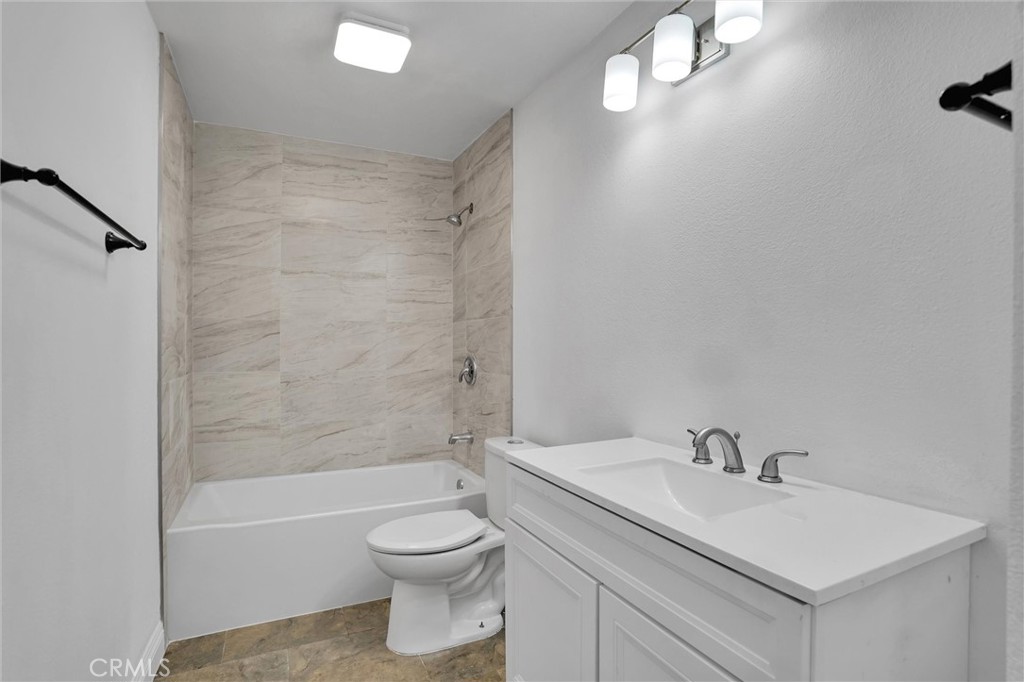 20233 Enslow Drive Carson, CA 90746 - Photo 15 of 22 a bathroom with a sink a toilet and shower