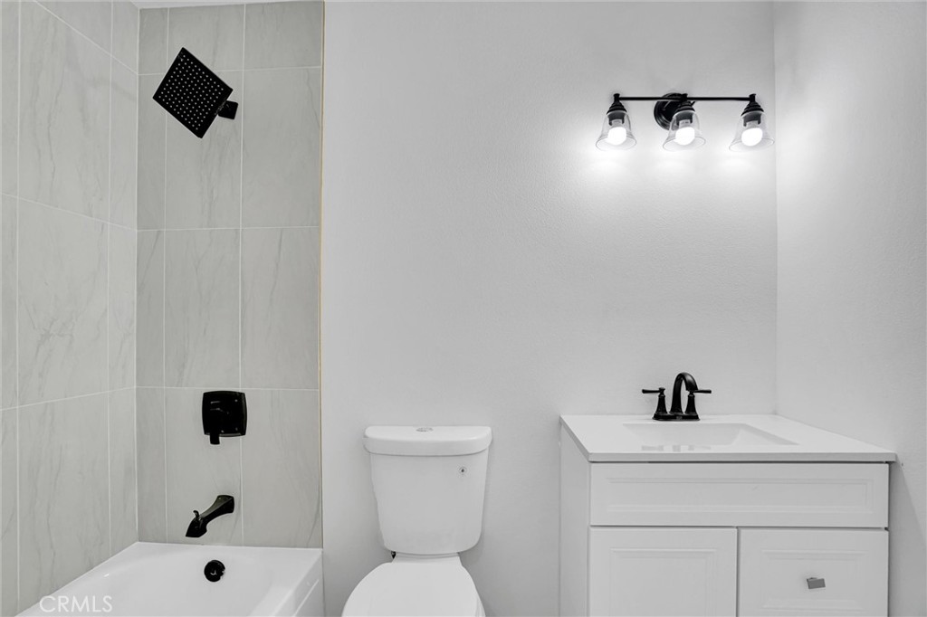 20233 Enslow Drive Carson, CA 90746 - Photo 18 of 22 a bathroom with a sink toilet and shower