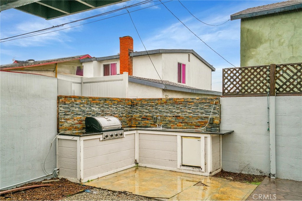 20233 Enslow Drive Carson, CA 90746 - Photo 19 of 22 a kitchen with a stove and a refrigerator