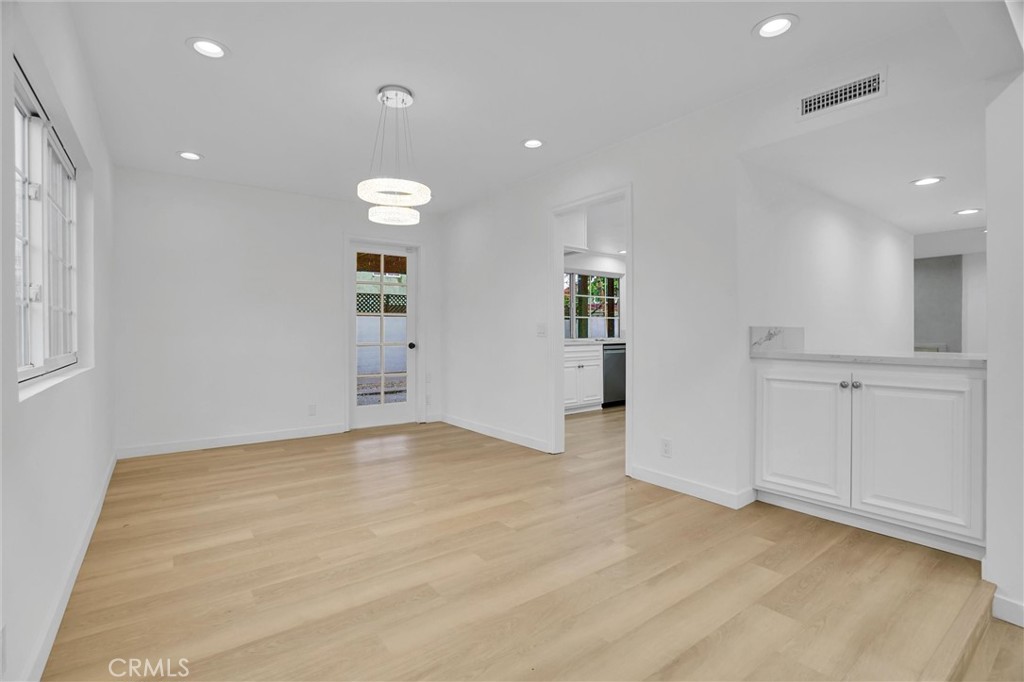 20233 Enslow Drive Carson, CA 90746 - Photo 5 of 22 an empty room with windows and cabinet