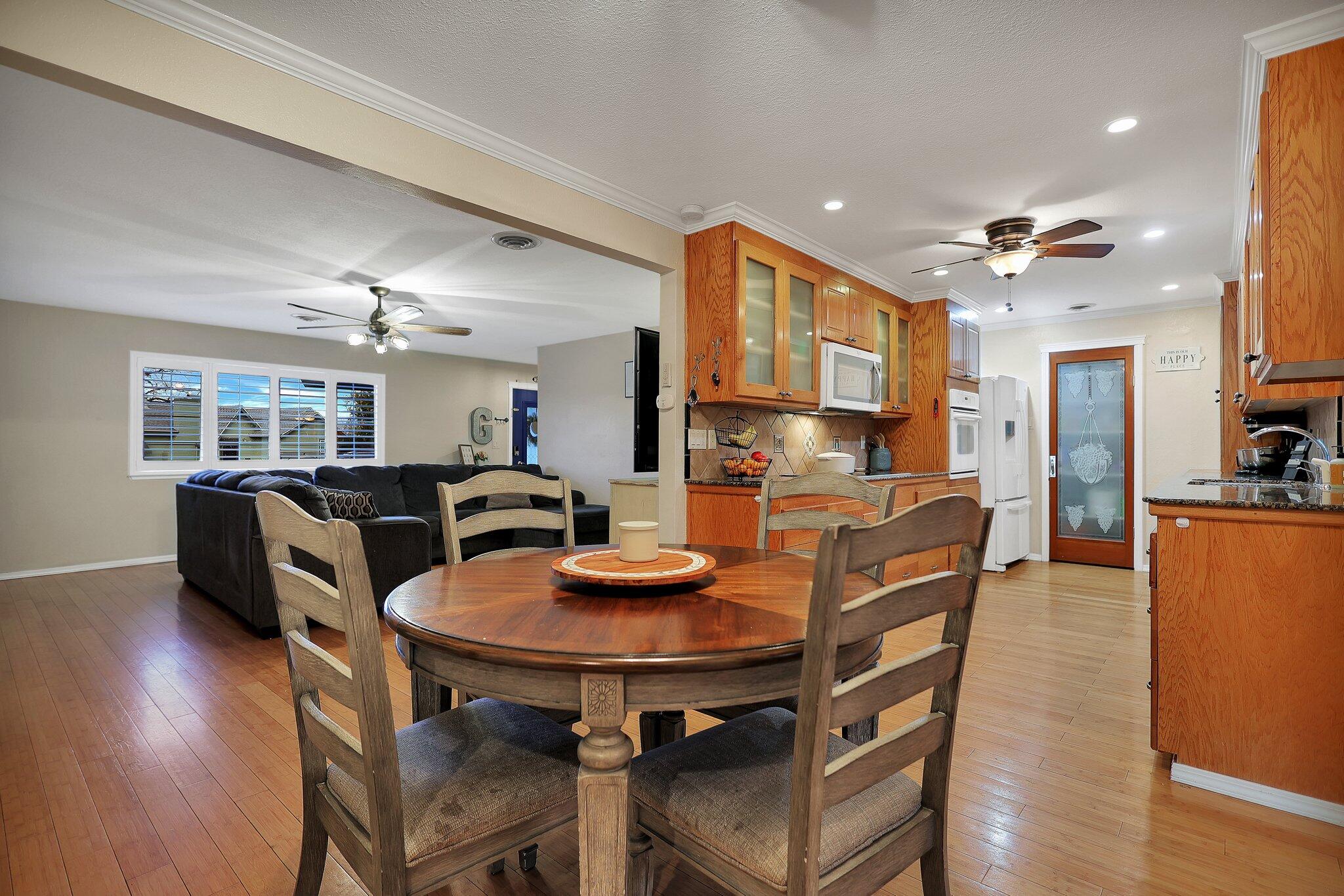 720 Lakeview Drive Redding, CA 96001 - Photo 12 of 38 a view of a dining room with furniture and wooden floor