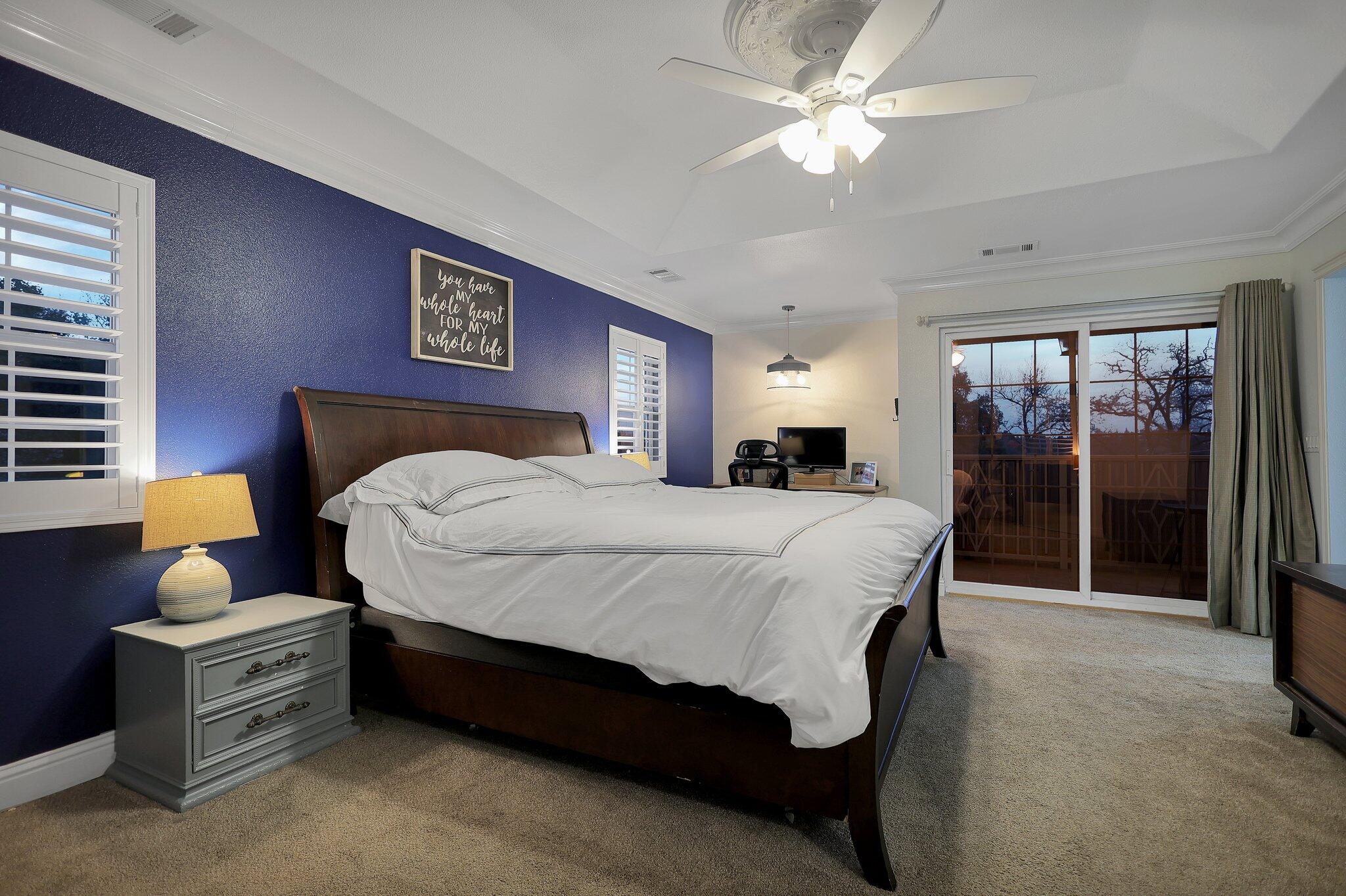 720 Lakeview Drive Redding, CA 96001 - Photo 15 of 38 a bedroom with a bed mirror and a large window