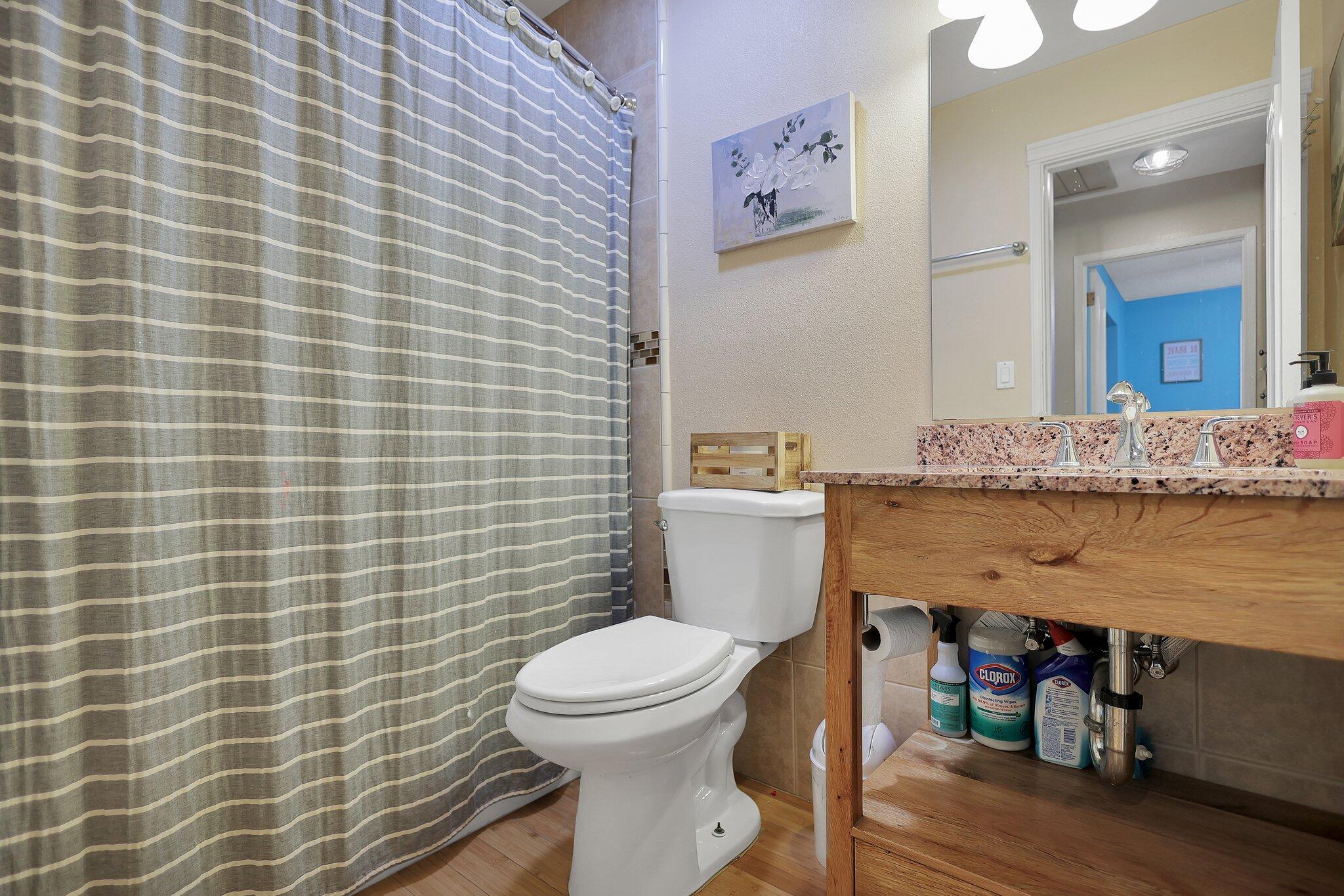 720 Lakeview Drive Redding, CA 96001 - Photo 26 of 38 a bathroom with a granite countertop toilet and a mirror