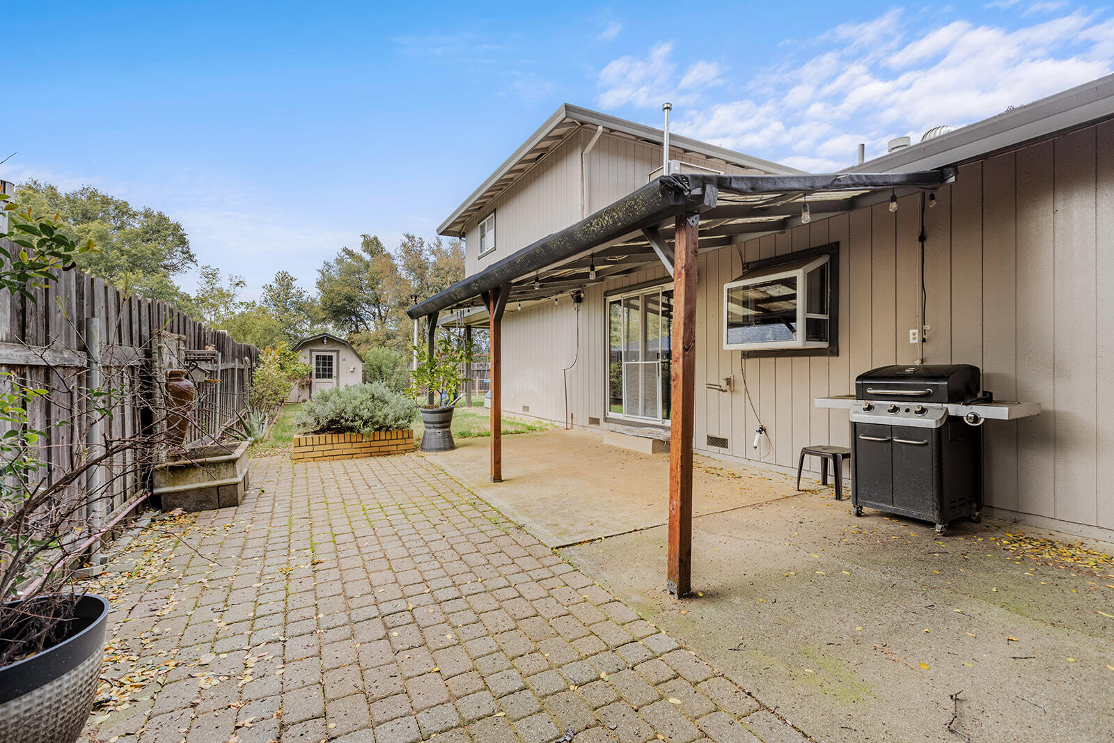 720 Lakeview Drive Redding, CA 96001 - Photo 34 of 38 a view of a house with backyard and sitting area