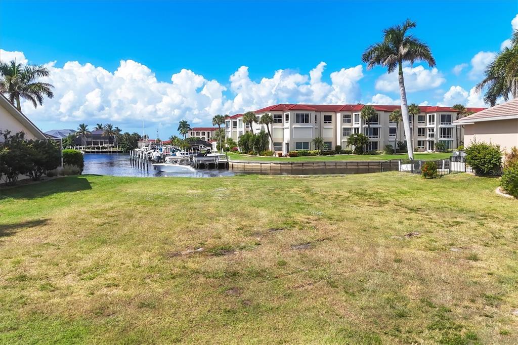 7 Hibiscus Drive Punta Gorda, FL 33950 - Photo 9 of 23 a view of a swimming pool with a garden and plants