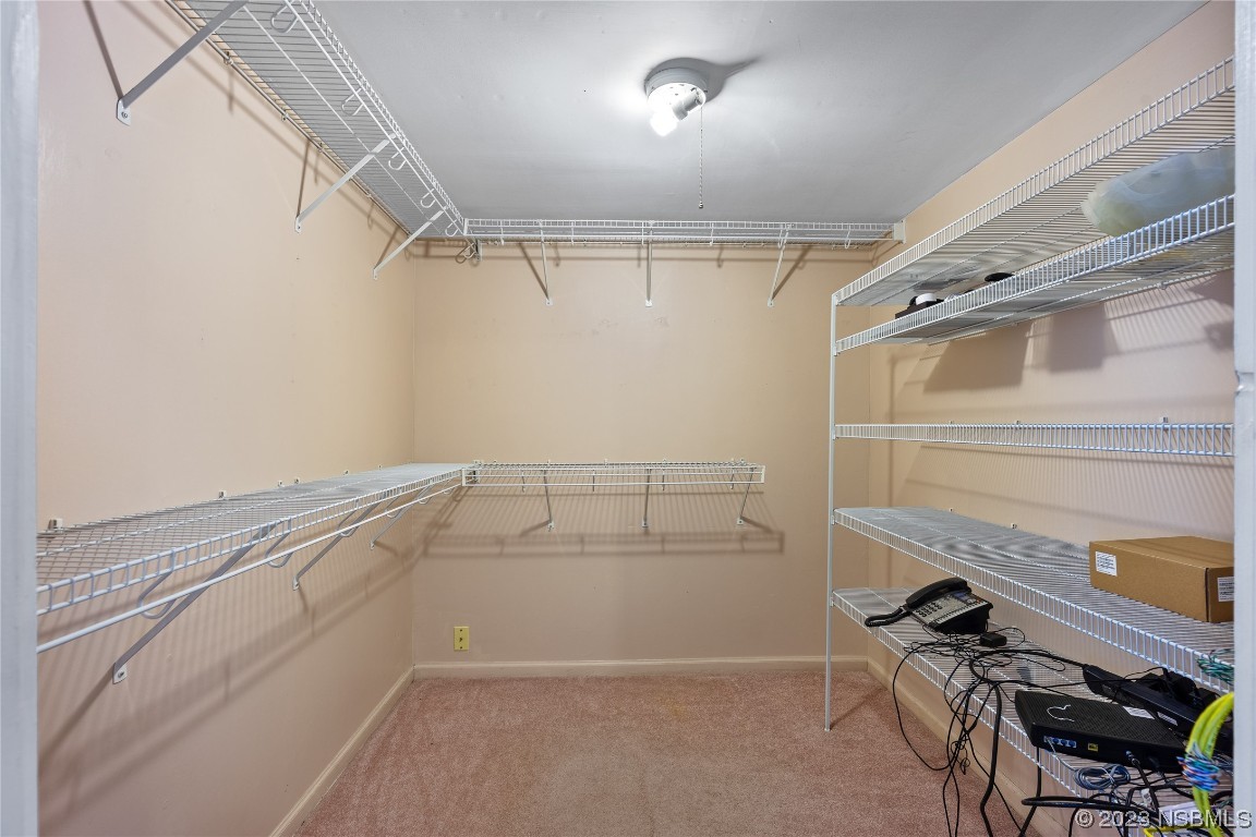 108 South Ridgewood Avenue Edgewater, FL 32132 - Photo 11 of 23 a view of storage and utility room with racks on the wall