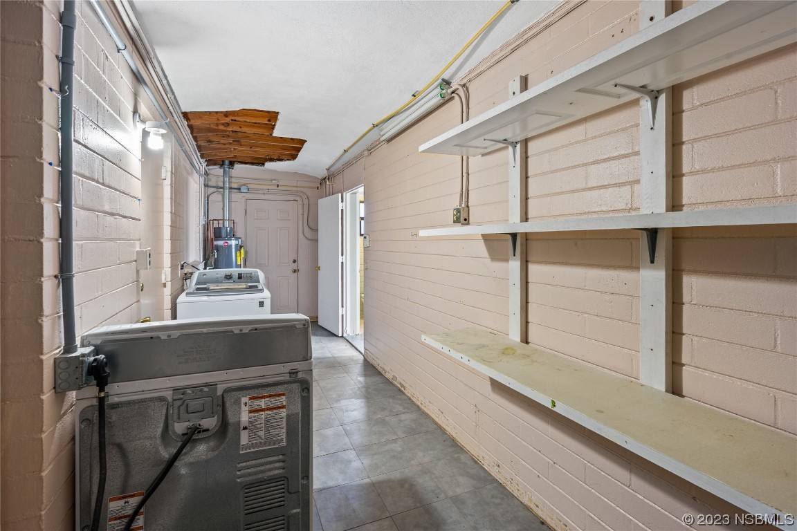 108 South Ridgewood Avenue Edgewater, FL 32132 - Photo 17 of 23 a bathroom with a sink a mirror and shower