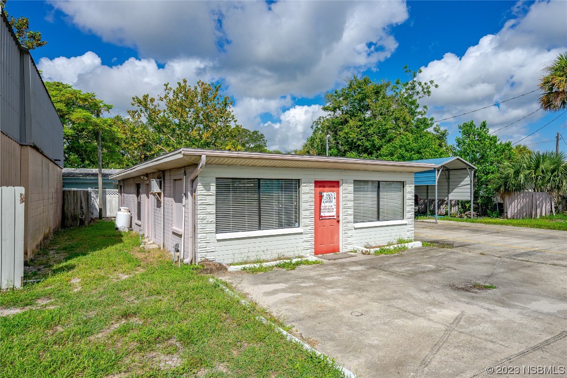 108 South Ridgewood Avenue Edgewater, FL 32132 - Photo 22 of 23 front view of a house with a yard