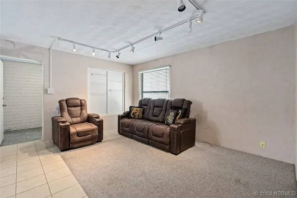 a kitchen with stainless steel appliances granite countertop a refrigerator sink and cabinets
