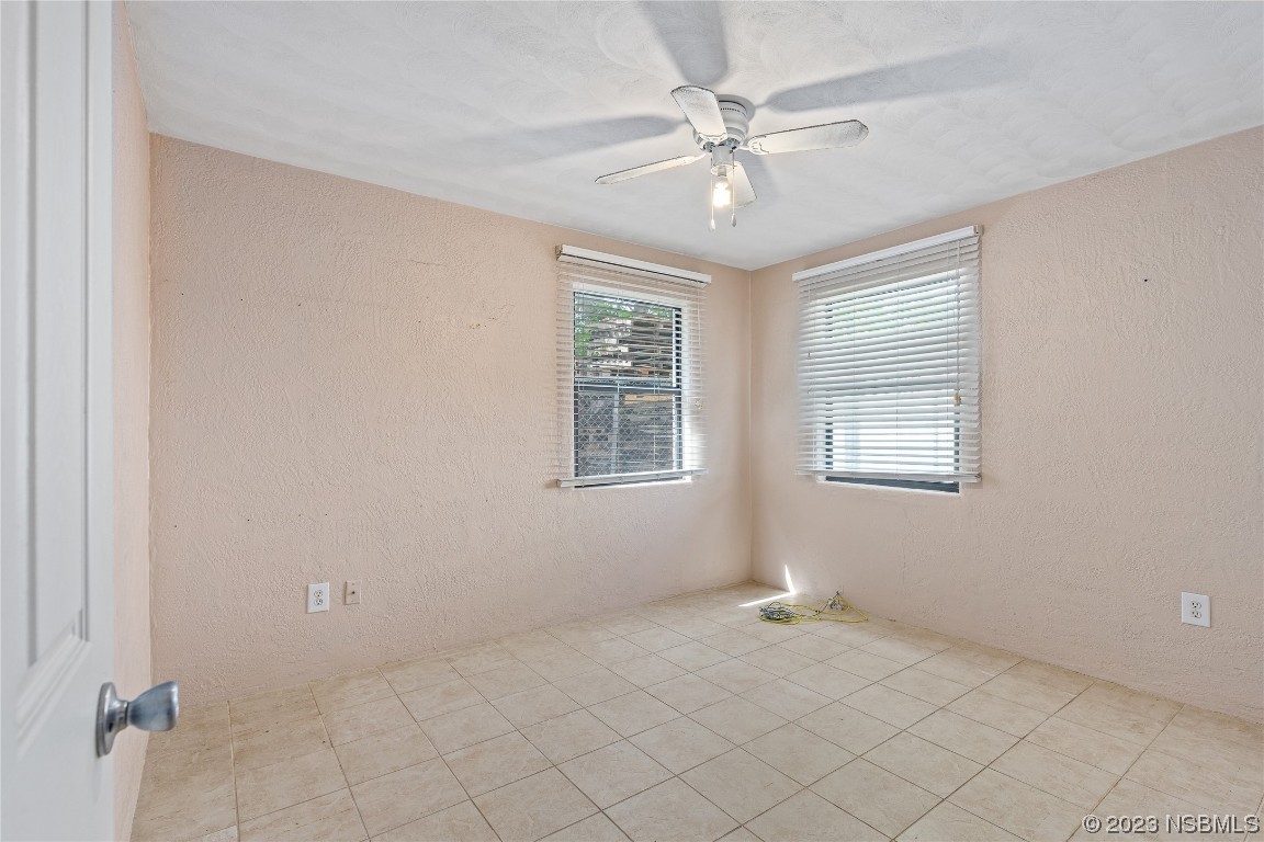 108 South Ridgewood Avenue Edgewater, FL 32132 - Photo 7 of 23 a view of an empty room with a window