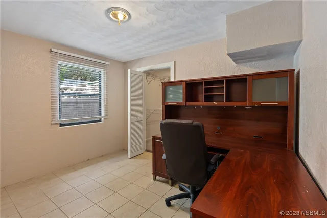 a view of storage and utility room with racks on the wall