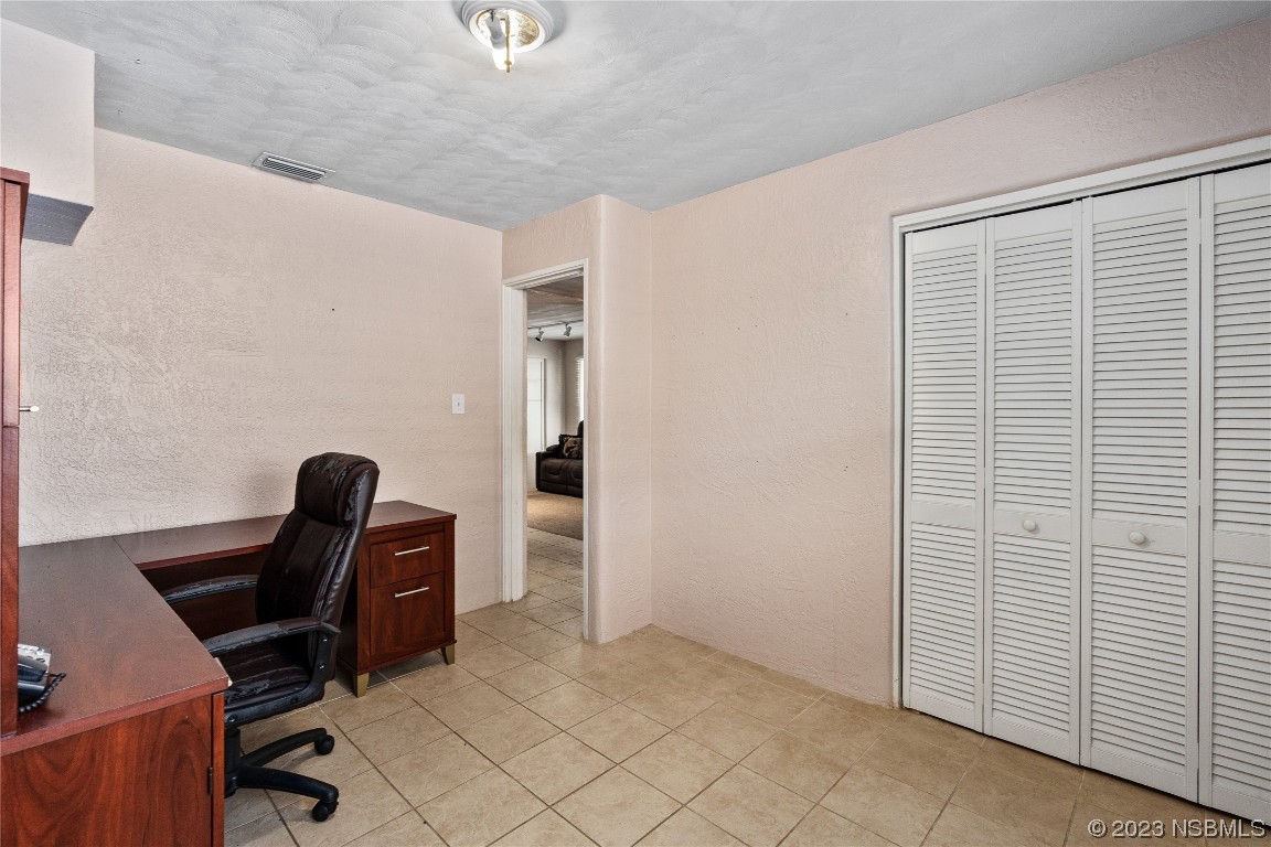 108 South Ridgewood Avenue Edgewater, FL 32132 - Photo 10 of 23 a view of workspace with windows