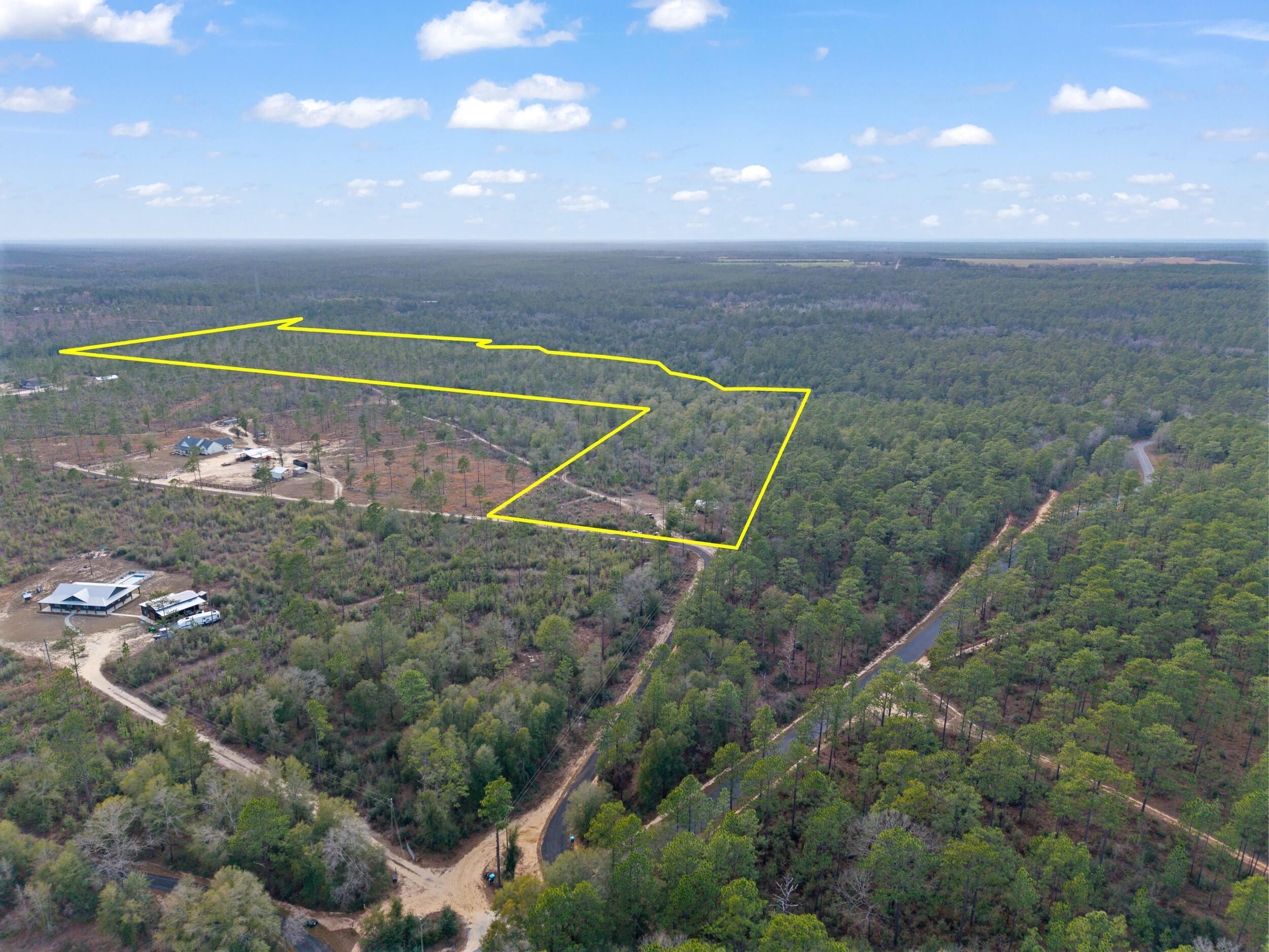 6130 Sherman Kennedy Road Baker, FL 32531 - Photo 7 of 9 a view of a tennis court