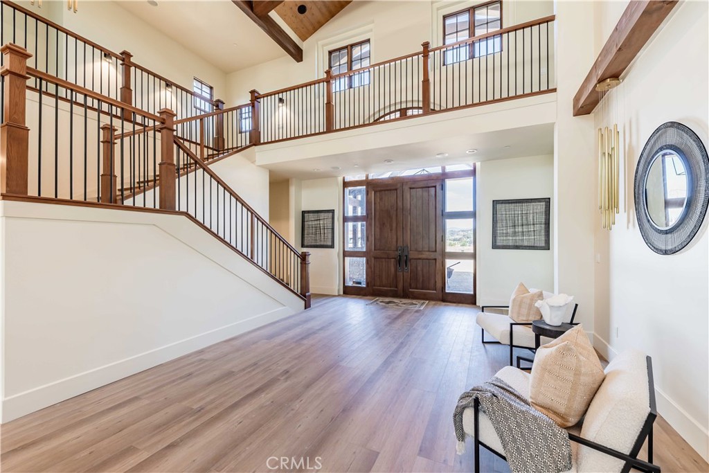 35995 Summit Circle Temecula, CA 92592 - Photo 17 of 75 a view of a hallway with wooden floor and staircase
