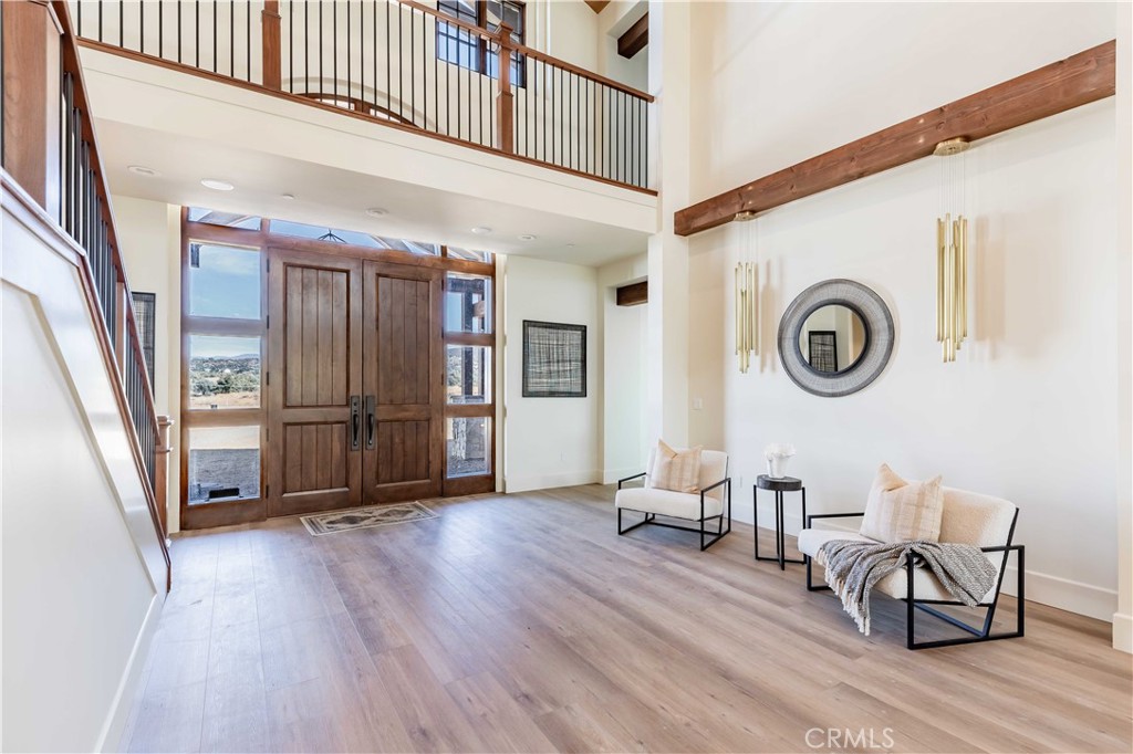 35995 Summit Circle Temecula, CA 92592 - Photo 18 of 75 a view of a hallway with furniture and wooden floor