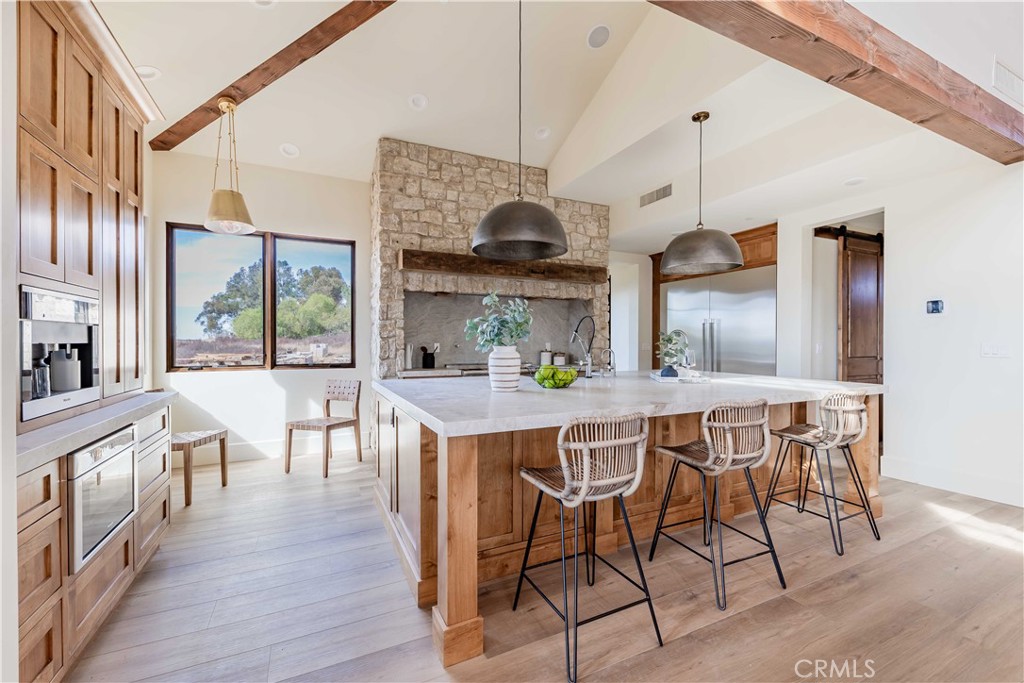 35995 Summit Circle Temecula, CA 92592 - Photo 25 of 75 a view of a dining room with furniture window and wooden floor