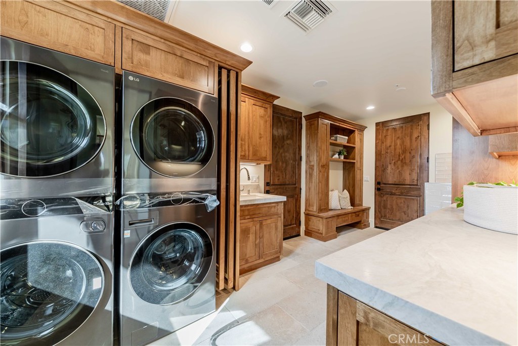 35995 Summit Circle Temecula, CA 92592 - Photo 33 of 75 a view of a kitchen with washer and dryer