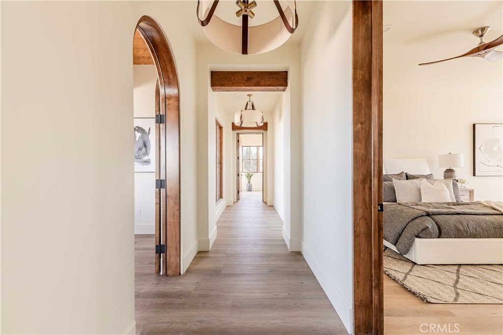 35995 Summit Circle Temecula, CA 92592 - Photo 38 of 75 a view of a hallway with wooden floor and a bathroom