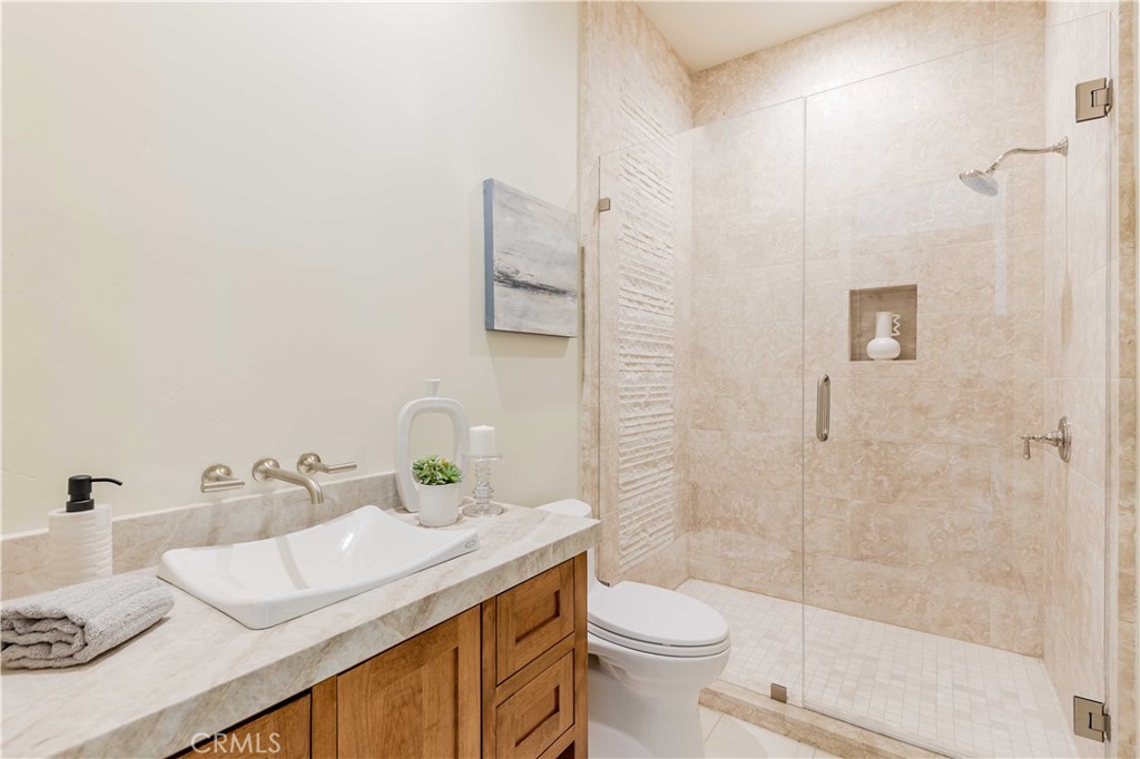 35995 Summit Circle Temecula, CA 92592 - Photo 54 of 75 a bathroom with a sink toilet and shower