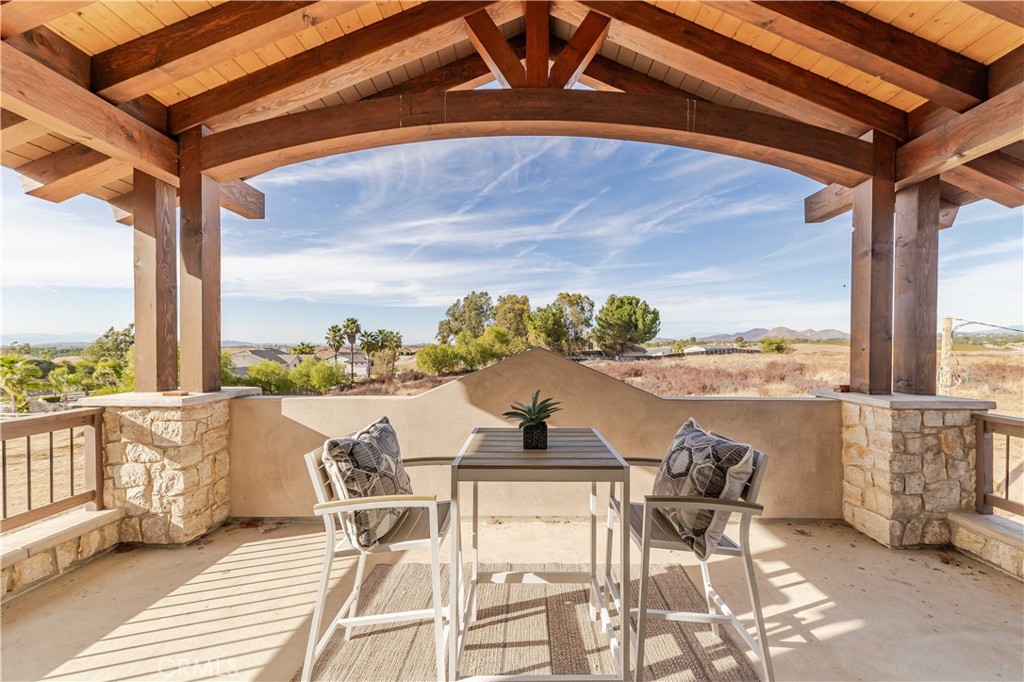 35995 Summit Circle Temecula, CA 92592 - Photo 66 of 75 a view of a balcony with chair and table