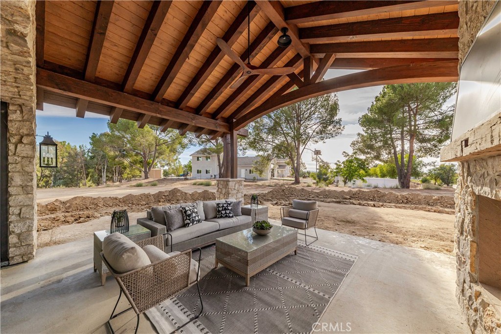 35995 Summit Circle Temecula, CA 92592 - Photo 68 of 75 a outdoor living space with patio furniture and a fireplace