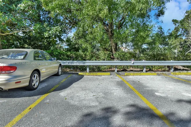 a view of a car is parked in a parking lot