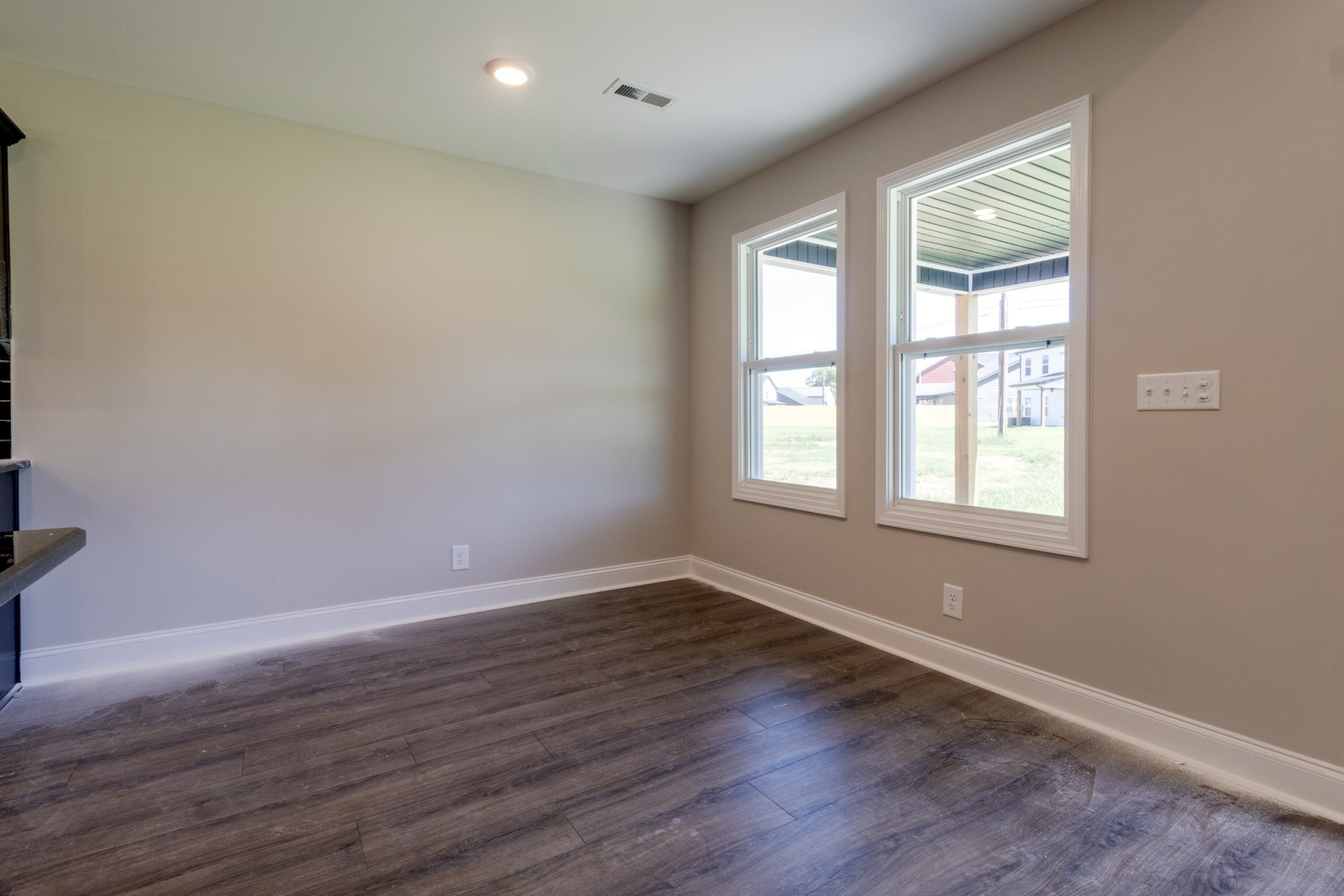 2909 Darrow Road Clarksville, TN 37042 - Photo 8 of 31 an empty room with wooden floor and windows