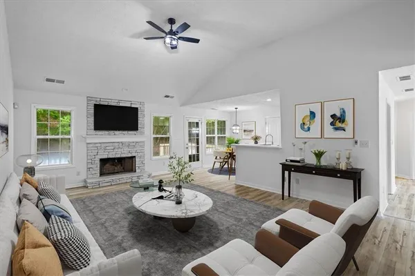 a living room with furniture and a fireplace