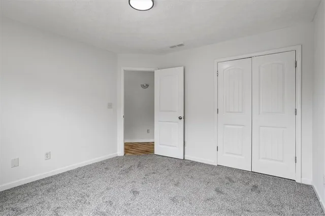 a view of an empty room and entryway