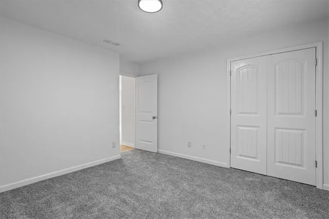 a view of an empty room and entryway