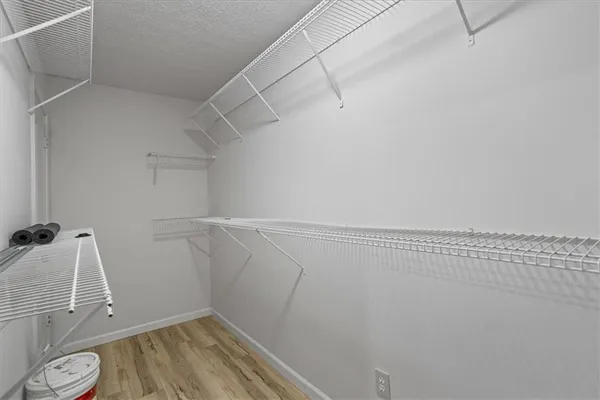 a view of a room with racks on the wall