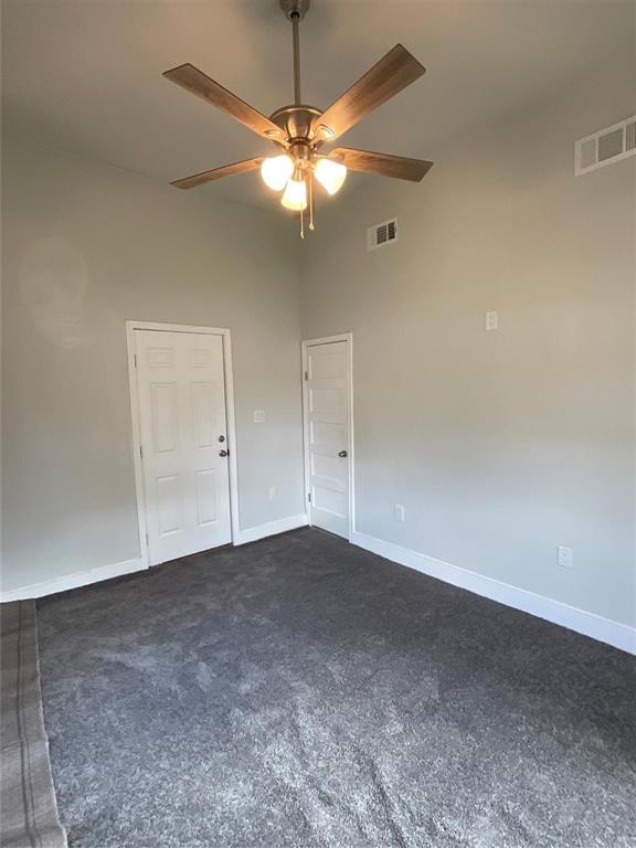 207 College Street Chico, TX 76431 - Photo 18 of 20 Spare room with dark colored carpet and a ceiling fan