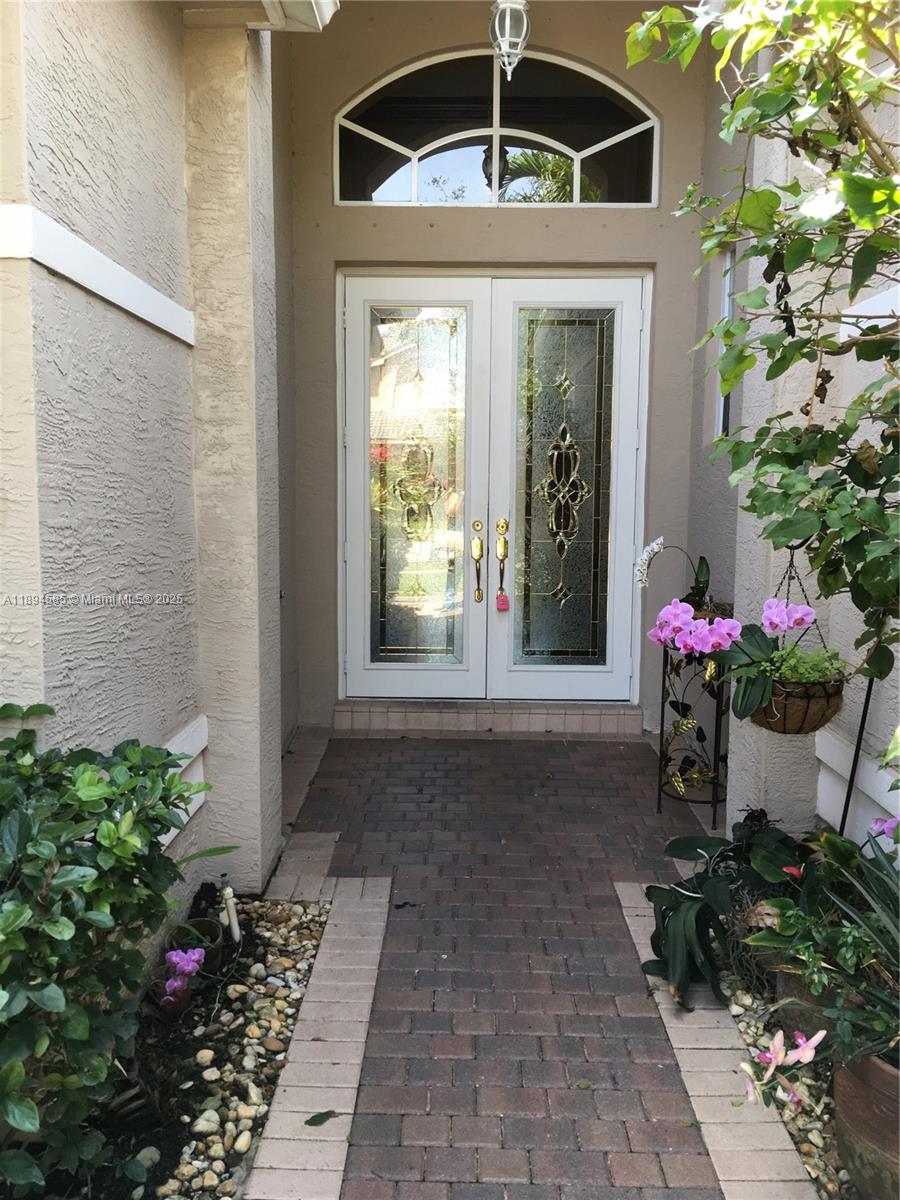 18580 Southwest 44th Street Miramar, FL 33029 - Photo 14 of 71 a front view of a house with a yard