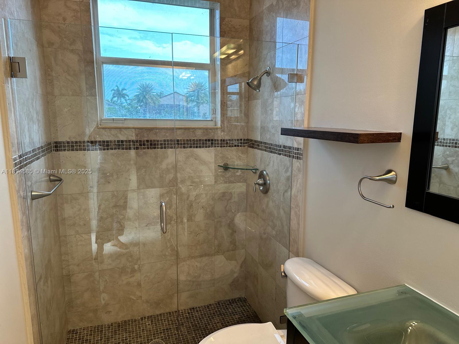 18580 Southwest 44th Street Miramar, FL 33029 - Photo 20 of 71 a bathroom with a shower and toilet