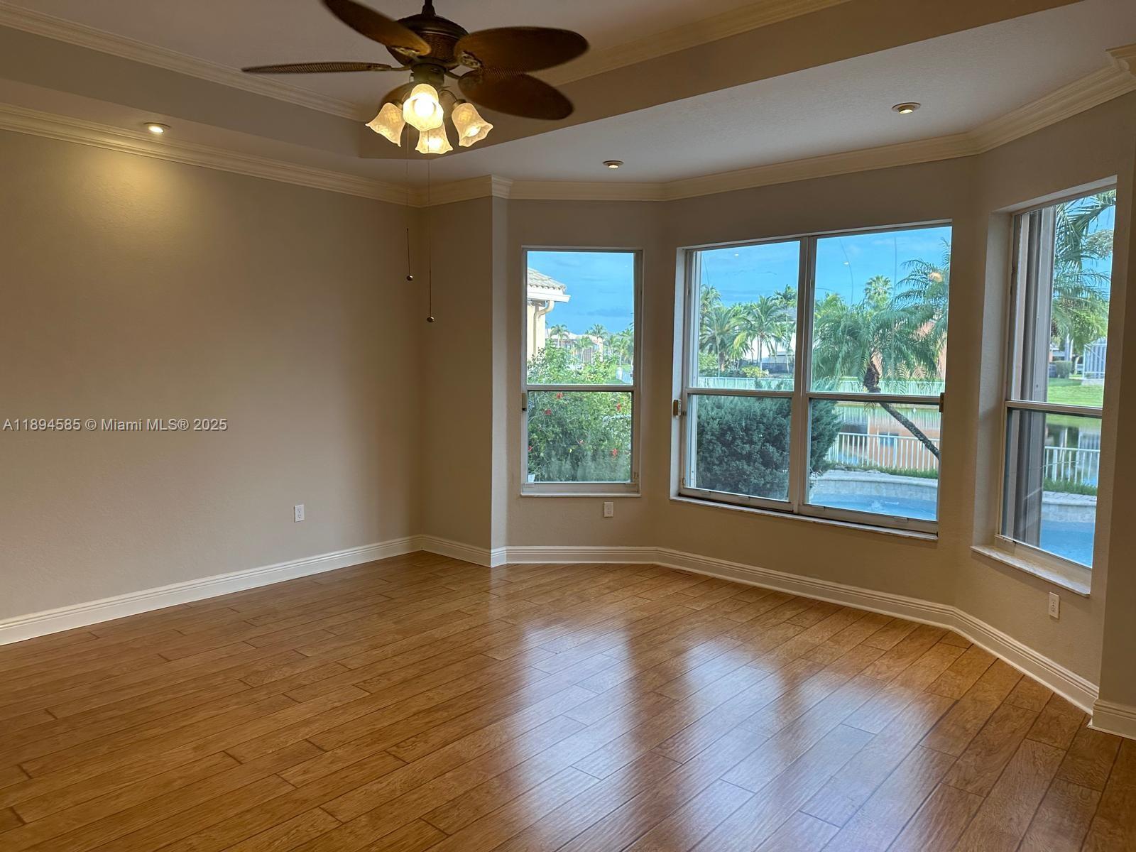 18580 Southwest 44th Street Miramar, FL 33029 - Photo 23 of 71 a view of an empty room with wooden floor and a window