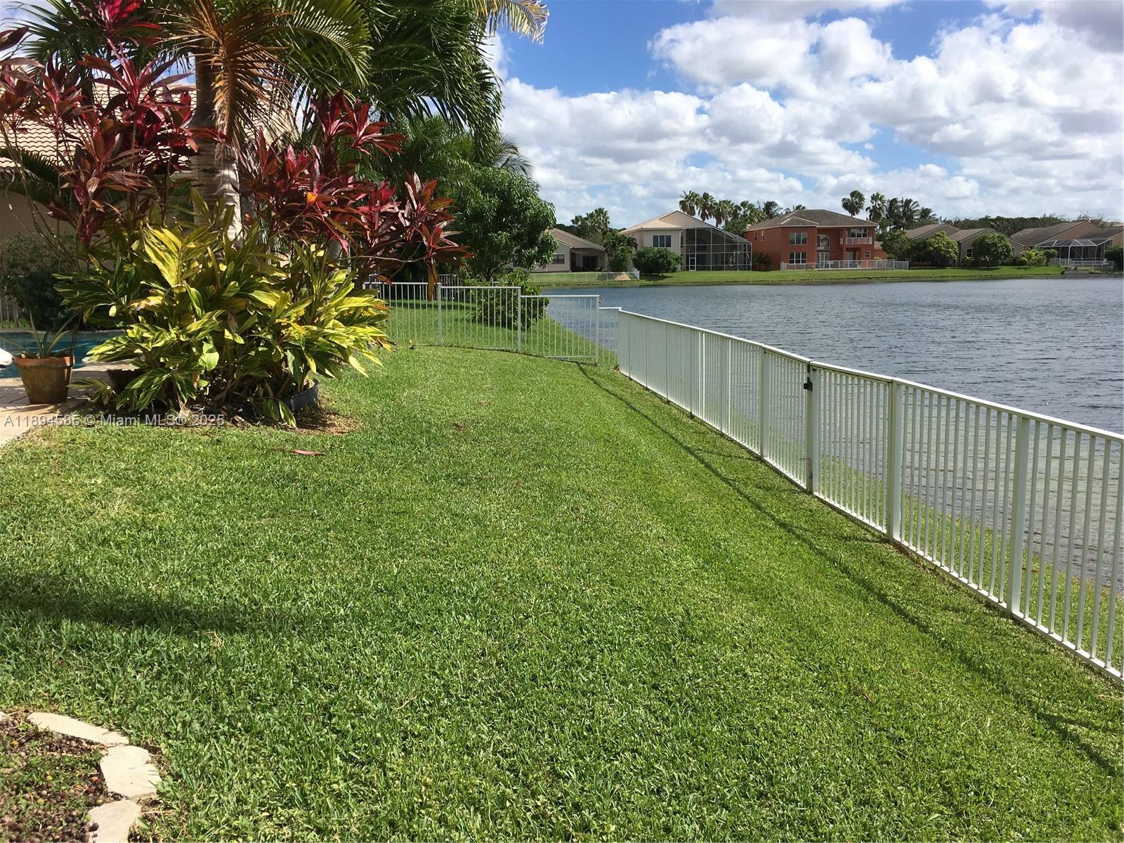18580 Southwest 44th Street Miramar, FL 33029 - Photo 31 of 71 a view of a lake with a yard